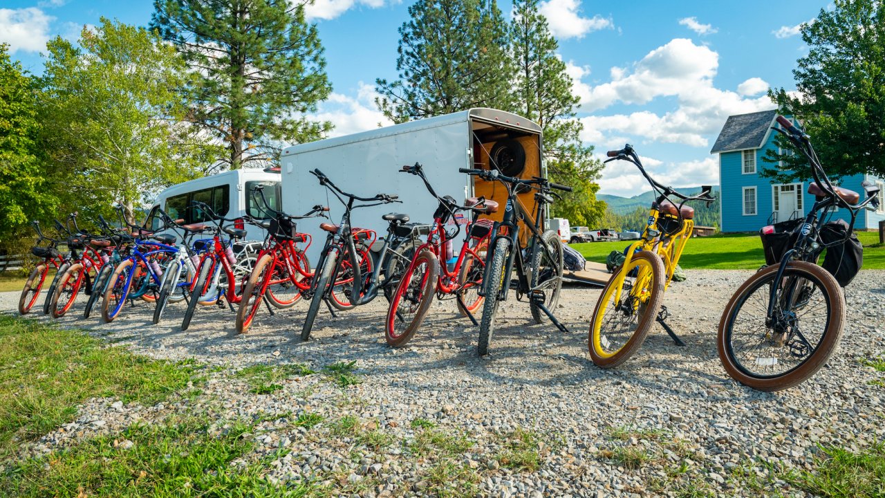 A row of e bikes lined up outside of a trailer