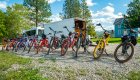 A row of e bikes lined up outside of a trailer