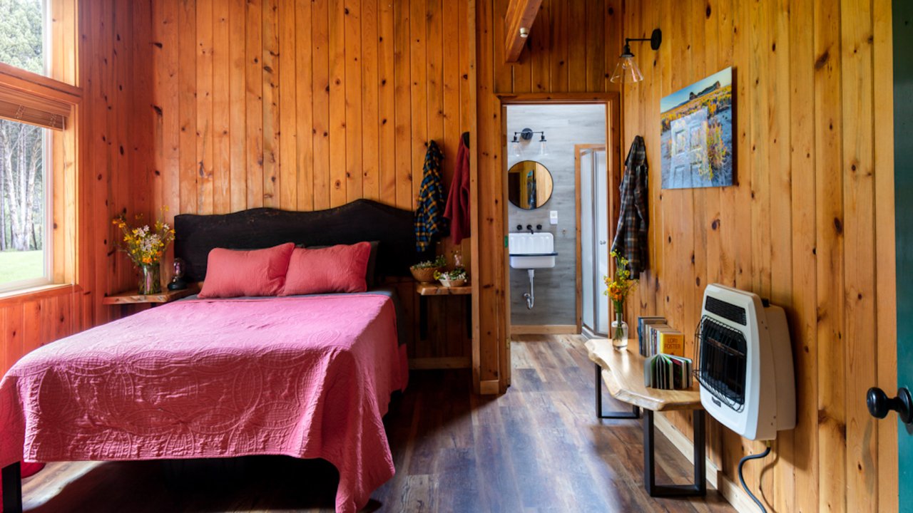 Single bedroom cabin with one queen bed and bathroom