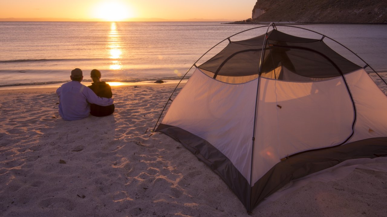 Watching the sunset through a tent in Baja, California