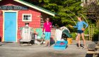 Guests playing corn hole on the deck at God's Pocket Resort