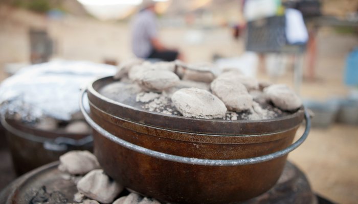 dutch oven toped in coals