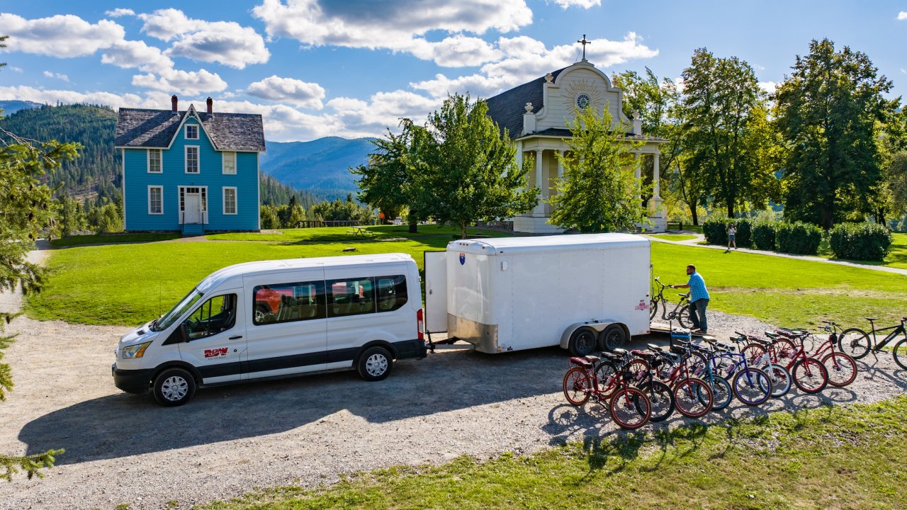 E-bikes being unloaded from a trailer attached to a white van in Idaho