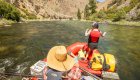 Woman casting a line off of a raft on the Salmon River