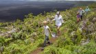 Family walking around a famous volcano in the Galapagos Islands