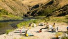 Tents set up on a sandy beach in Idaho