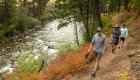 People hiking on a trail along the Salmon River