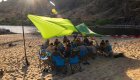 Group dinner on a sandy Snake River beach in Hells Canyon, Idaho, after a day of rafting and hiking adventures.