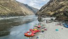 Rafts and sandy riverside campsite along the Lower Salmon River in Idaho, a popular rafting destination through Salmon River canyons.