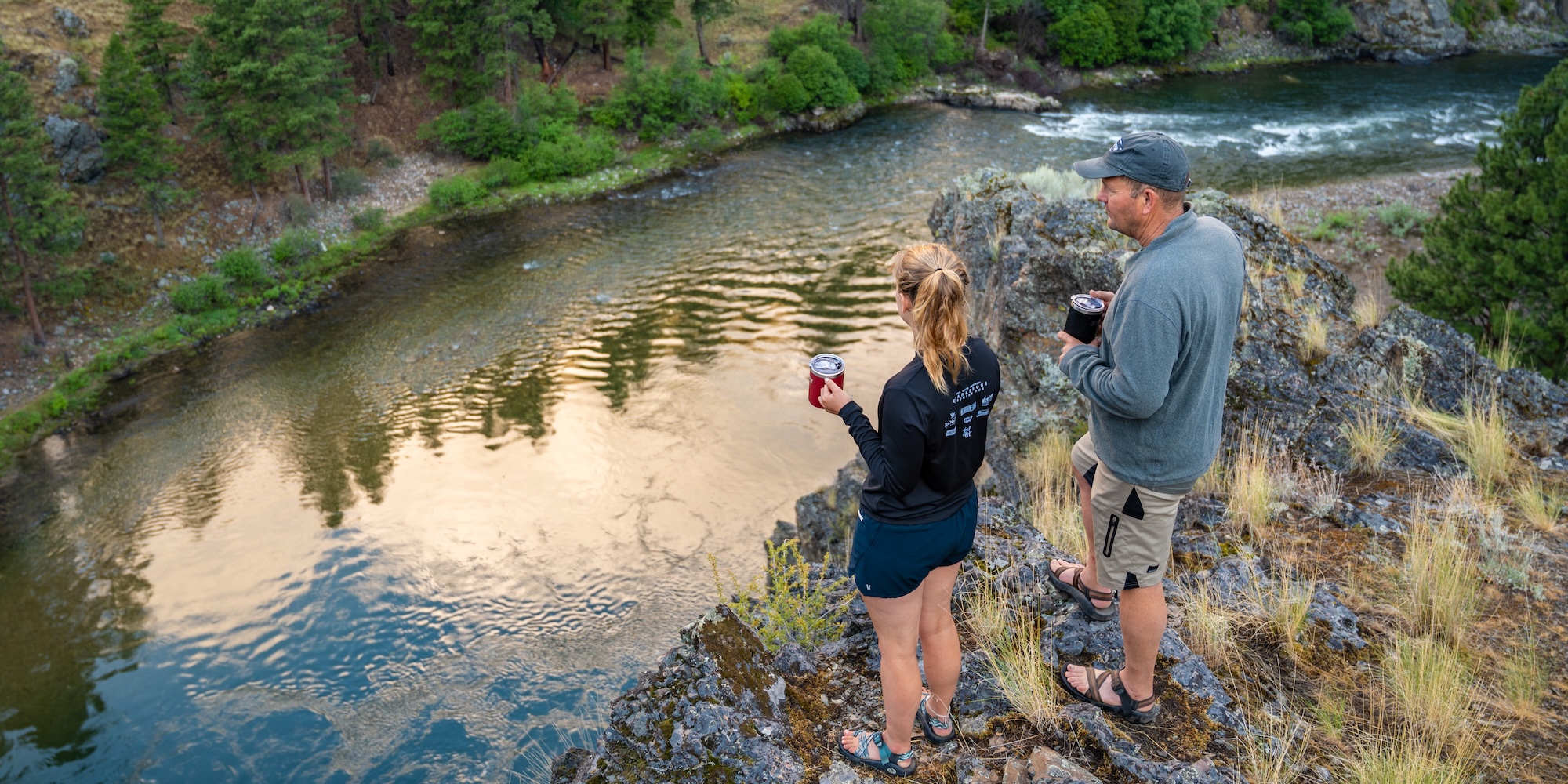 Two people observing an Idaho river. 