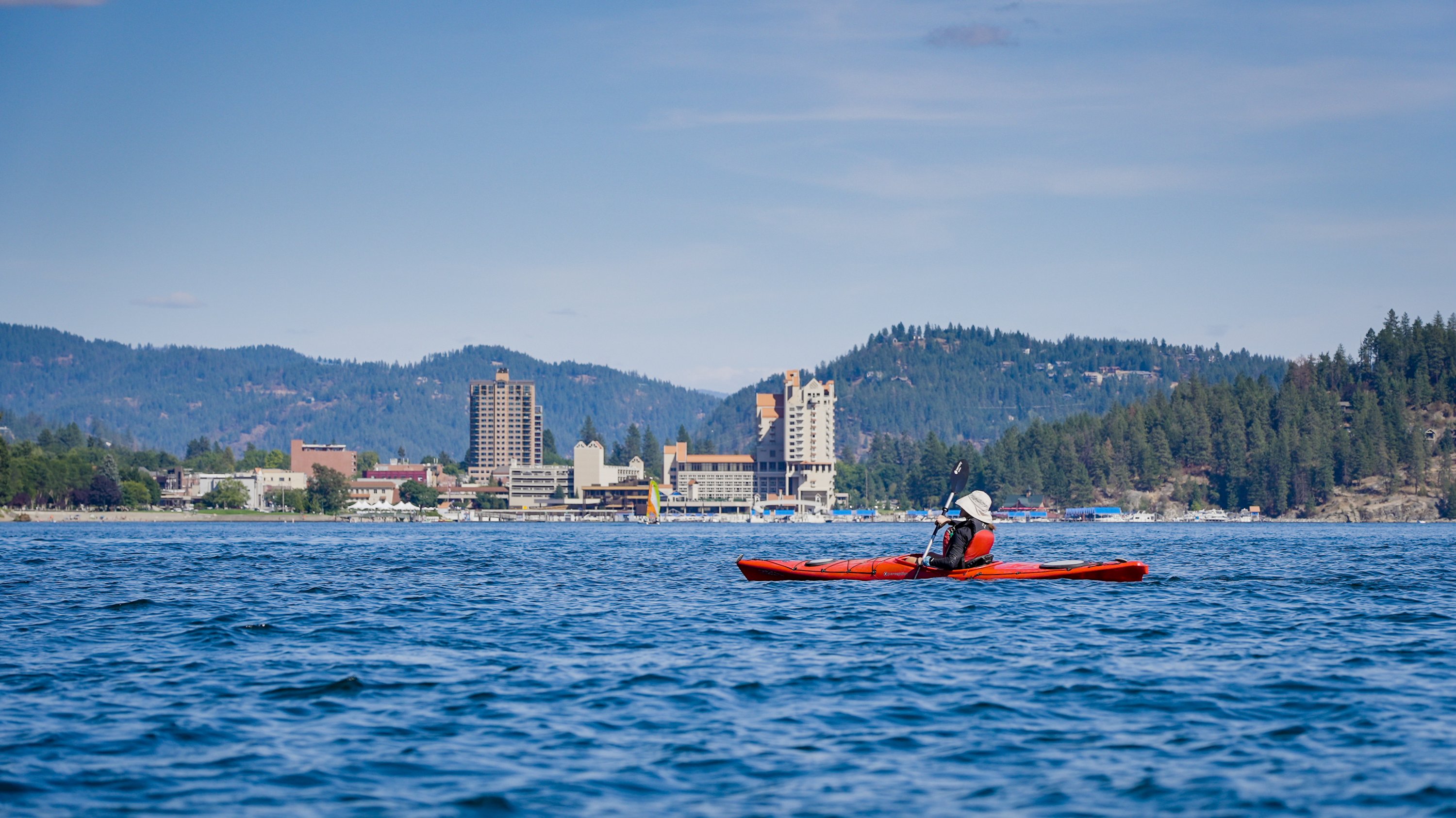 Person kayaking on Lake Coeur D'Alene in Northern Idaho