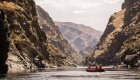 Raft floating through a calm section of Salmon River Canyons.