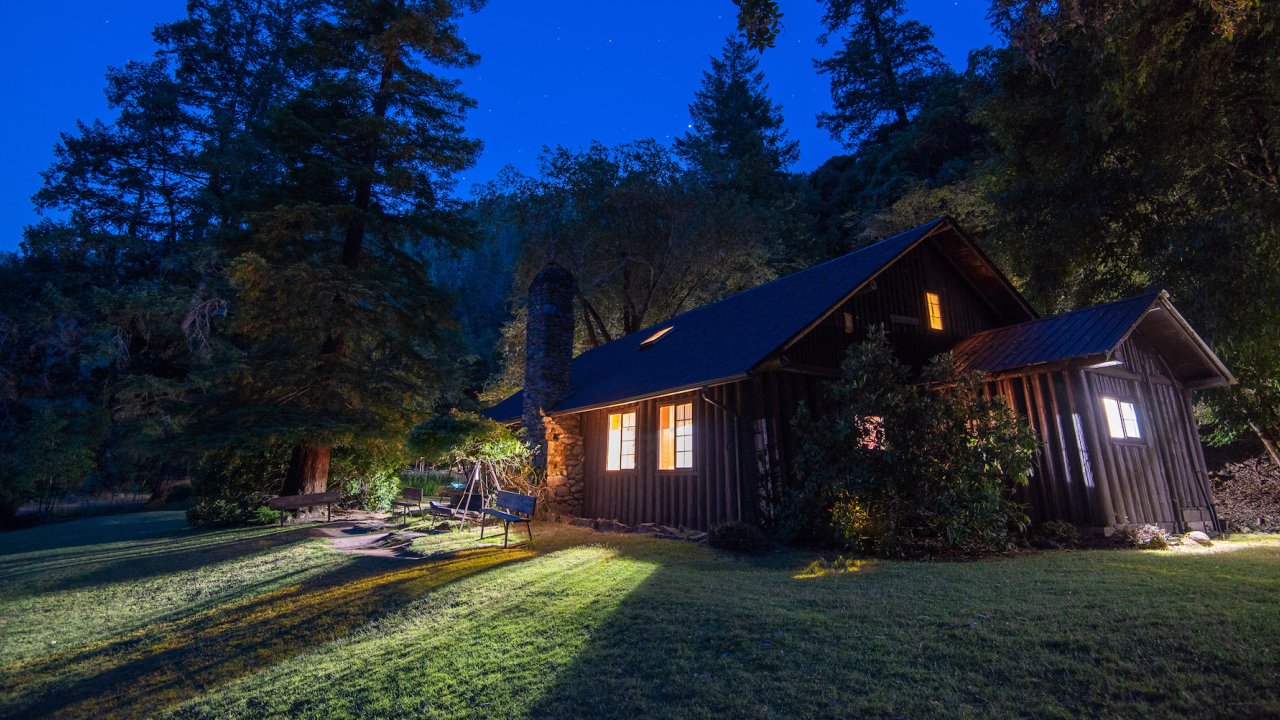 One of the Rogue River lodges lit up at night