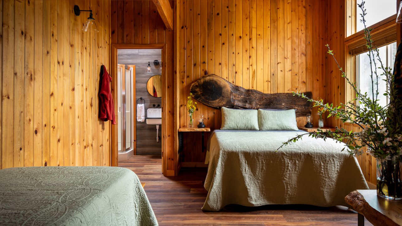 Two full beds in a small cabin in Oregon along the Rogue River