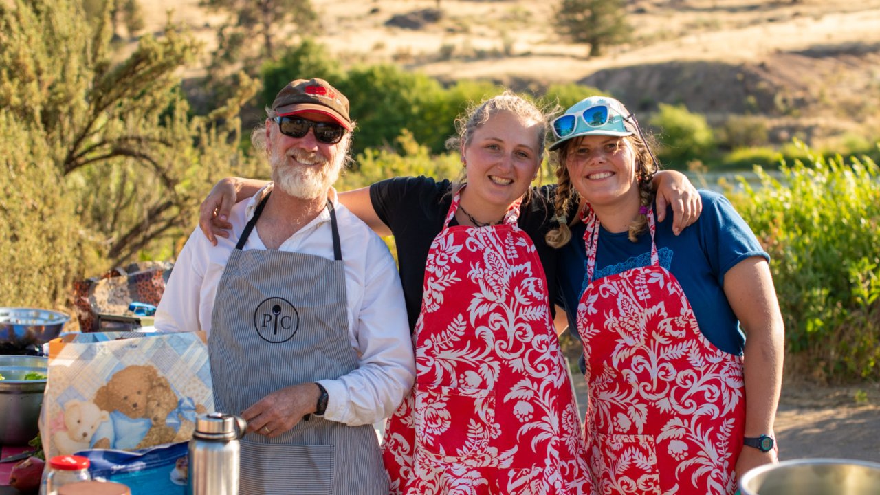 Whitewater rafting guides cooking in the camp kitchen in Oregon