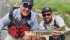 A guide and guest on a fly fishing tour of the Middle Fork Salmon River pose with a fish