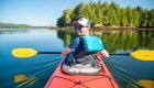 Happy kayaker smiling while on the Pacific Ocean