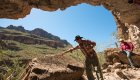 Guide explaining the history of a petroglyph in Santa Teresa Canyon