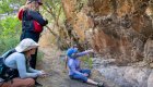 people looking at rock art along the snake river 