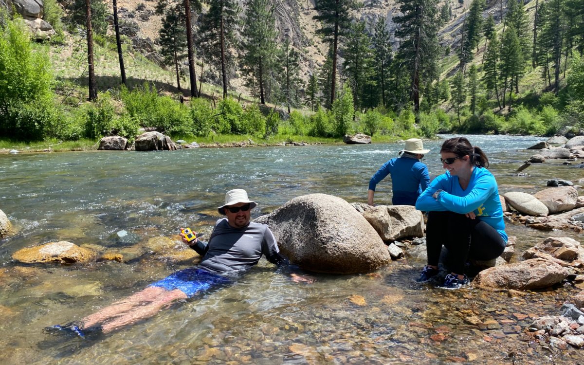A ROW Adventures group staying cool in the river.